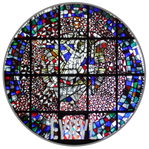 w okręgu postać anioła w uniesionych nad głową dłoniach trzyma róg obfitości z wysypującymi się z niego kiściami winogron, innymi owocami i kłosami zboża