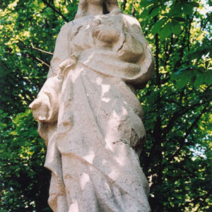 figura mężczyzny w lekkim kontrapoście z prawą ręką opuszczoną wzdłuż tułowia lewą zgiętą w łokciu i dłonią wskazującą na gorejące serce