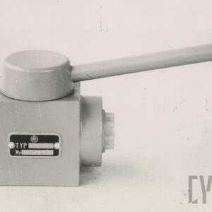 nieduże metalowe urządzenie w kształcie prostopadłościanu z uchwytem odcinającym przepływ