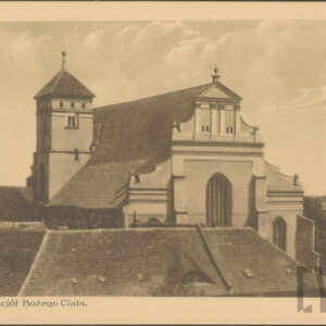 budynek sakralny z barokową fasadą i z wieżą po lewej stronie, na pierwszym planie dach niższego budynku