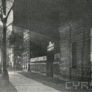 kamienice wzdłuż ulicy, po drugiej stronie drzewa